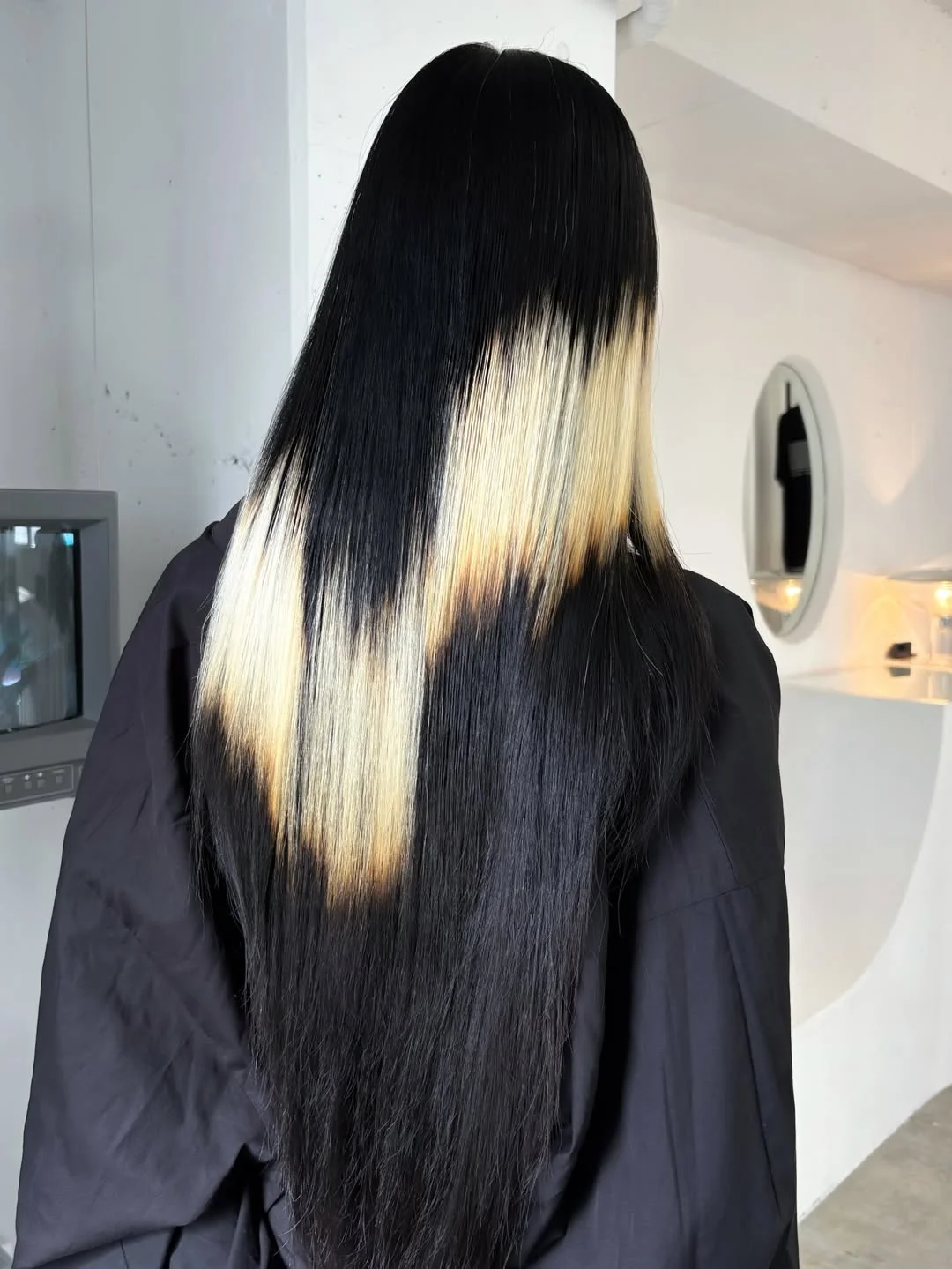 modern july hair colour ideas 2026 Graphic Blonde Panels on Jet Black Lengths