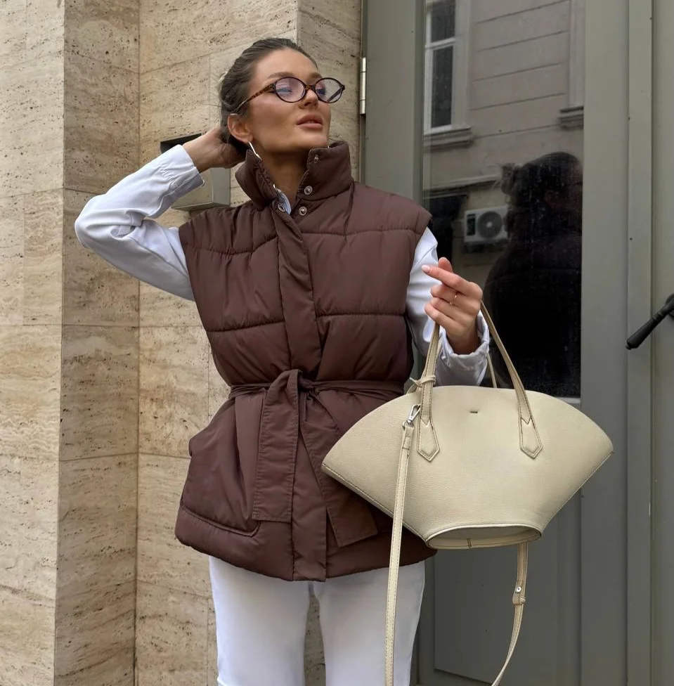 stylish fall outfits with vests 2026 A Belted Puffer Vest With Modern City Appeal