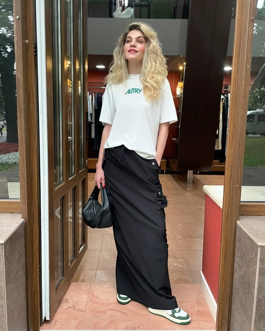 stylish fall skirt and sneakers outfits 2026 Modern Street Style With a Black Long Skirt and Sneakers