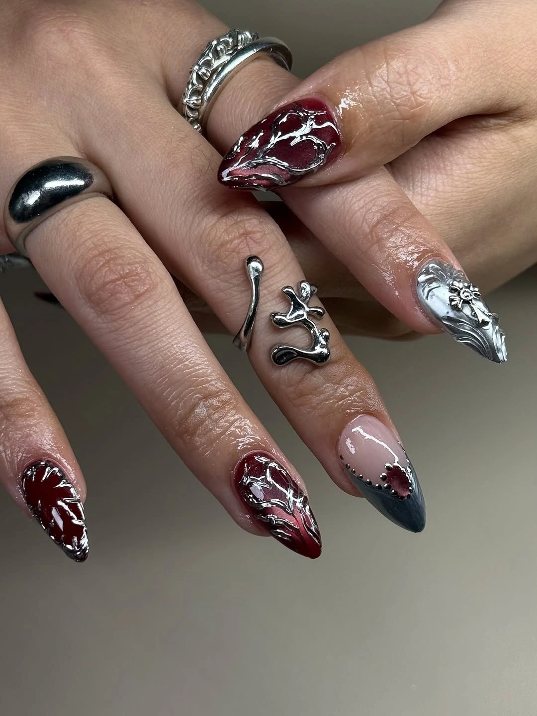 chic fall red nails 2026 Molten Burgundy Chrome With Gothic Silver Details