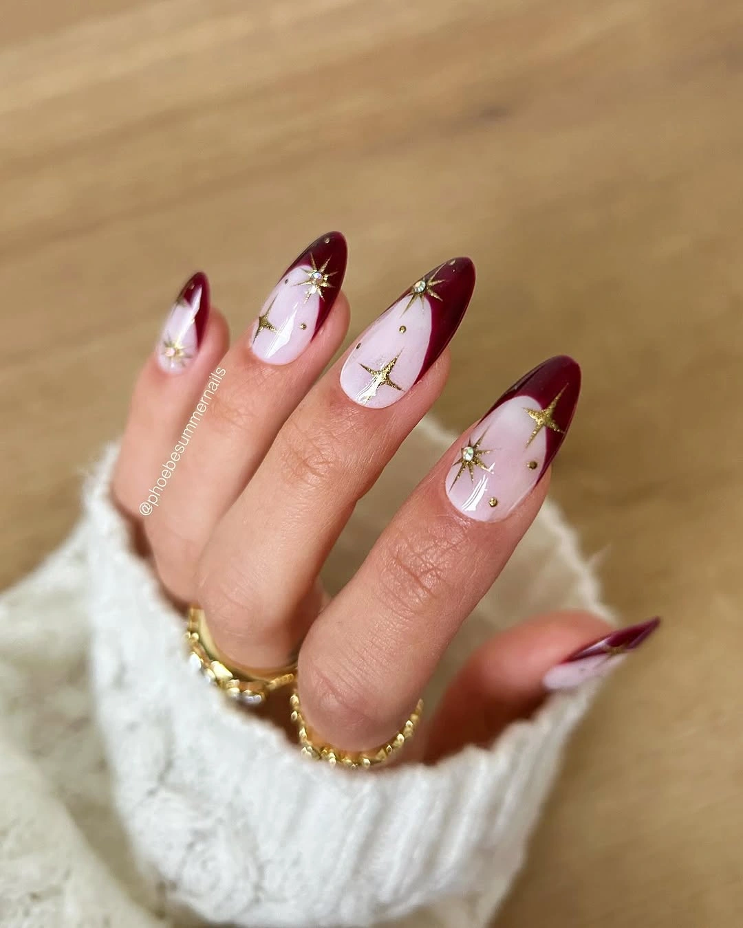 chic fall red nails 2026 Burgundy French Tips With Golden Stars