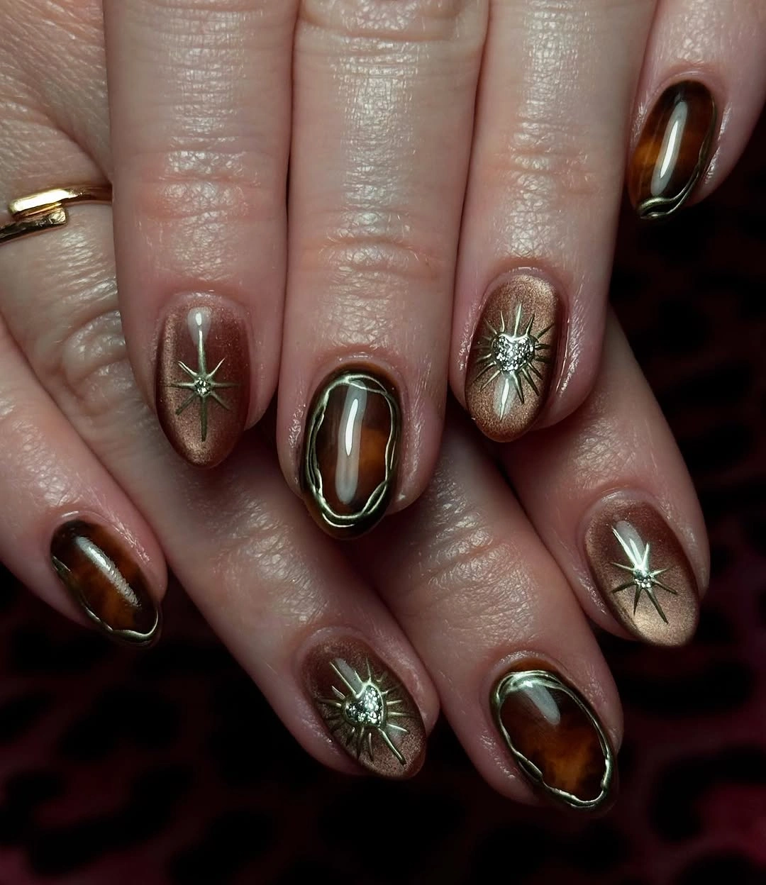chic september nails color 2026 Bronze Cat Eye With Celestial Accents
