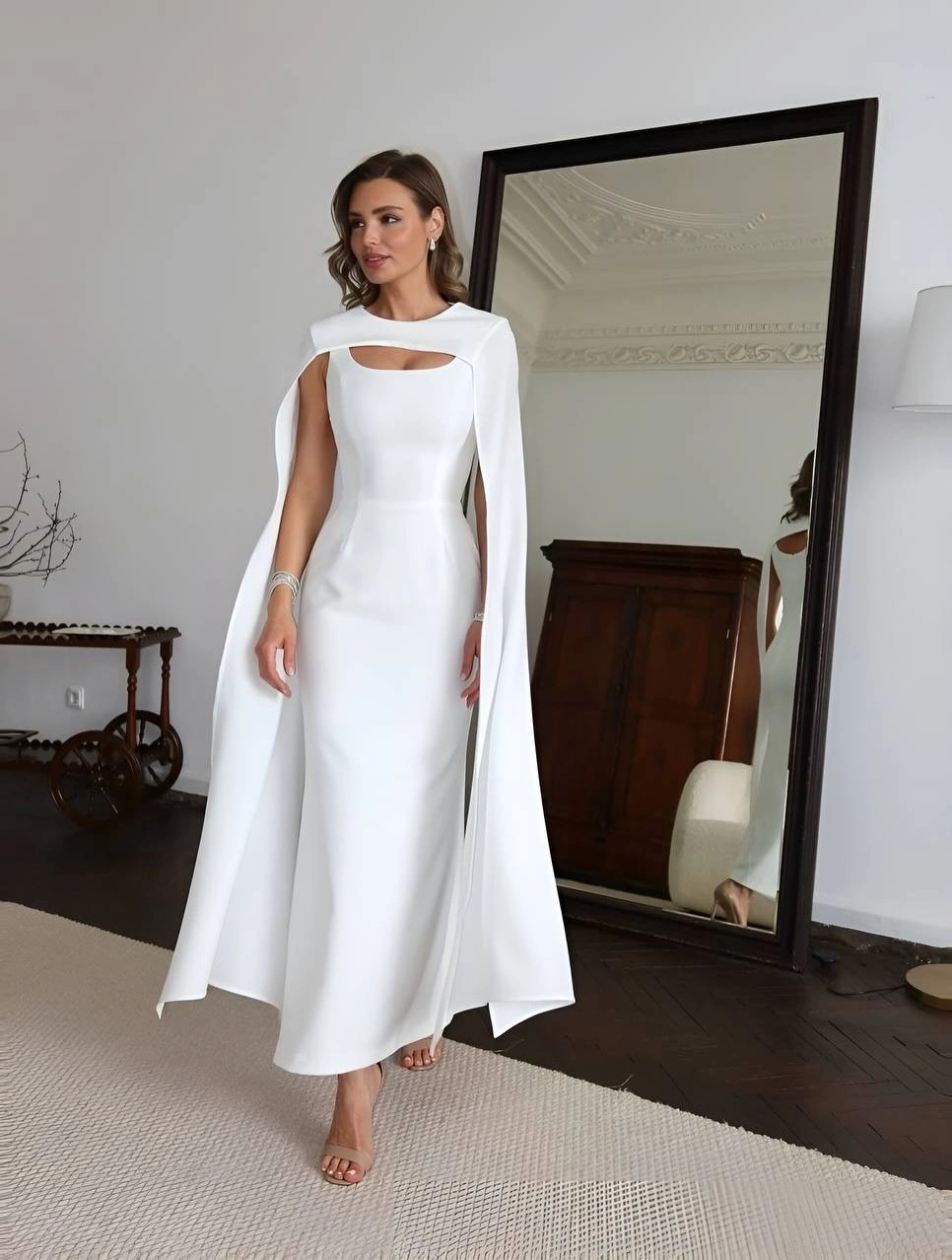 classic fall outfits 2026 Minimal White Dress With Dramatic Cape Sleeves
