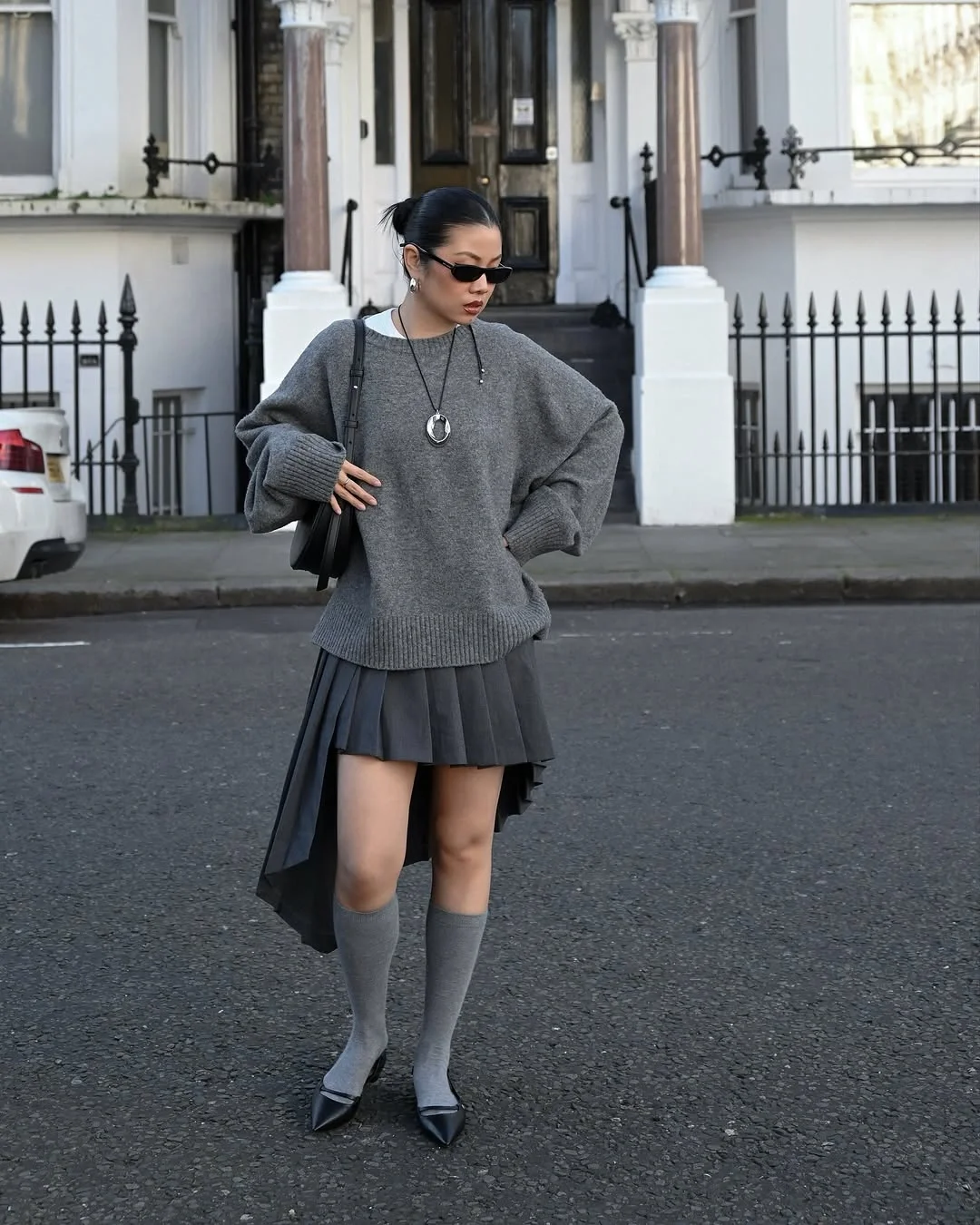 comfy fall outfits for lazy days 2026 Oversized Gray Knit with a Modern Pleated Skirt Twist