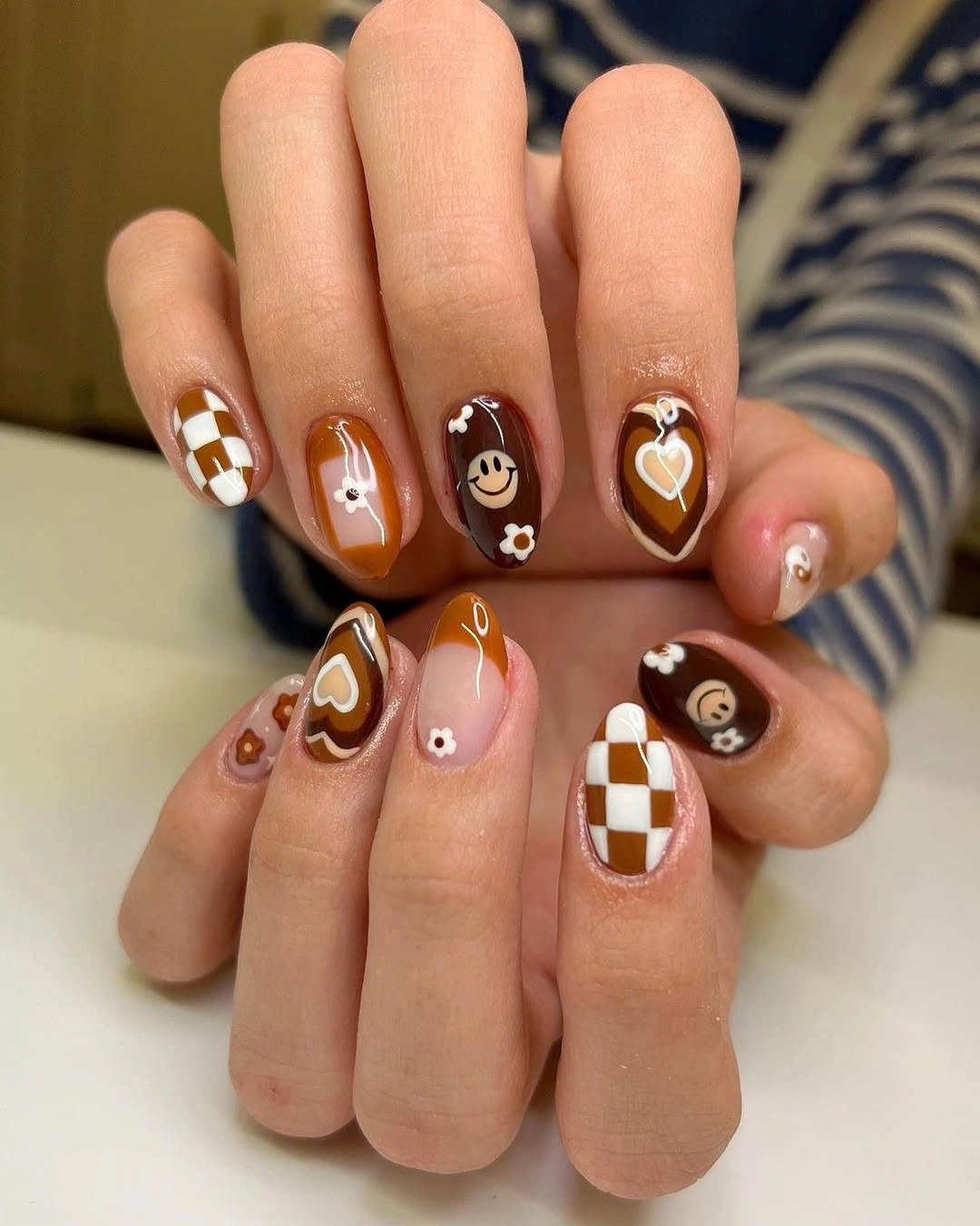 creative fall medium nail ideas 2026 Playful Mocha Mix With Retro Fall Nail Art
