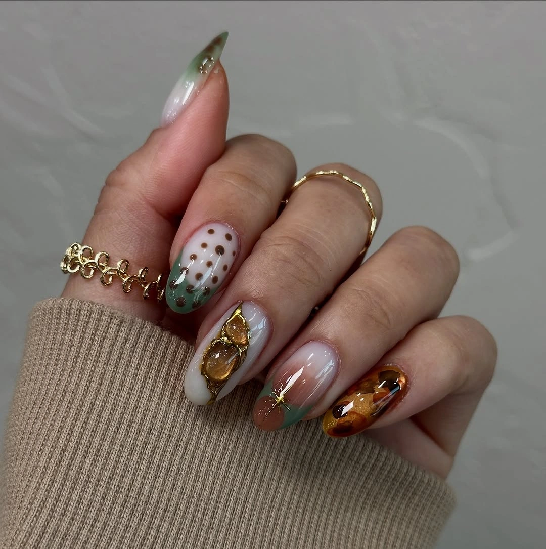 creative fall medium nail ideas 2026 Green French Tips With Amber Charms