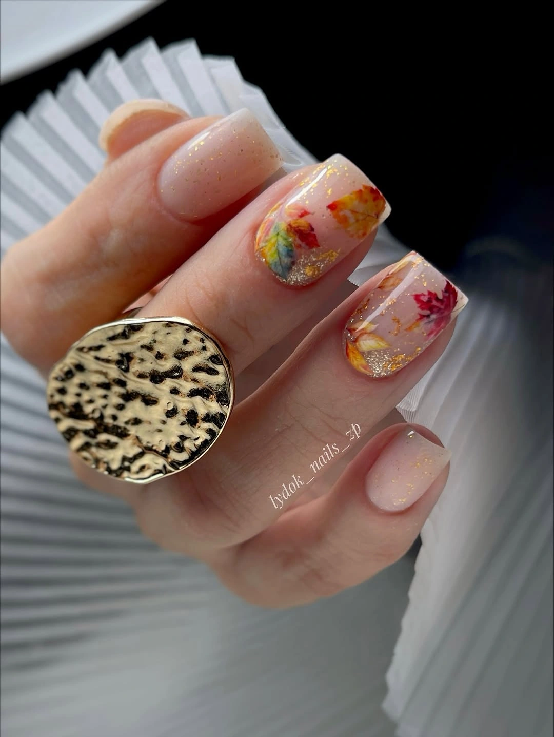 creative fall nail art 2026 Soft Glitter Nails With Colorful Autumn Leaves