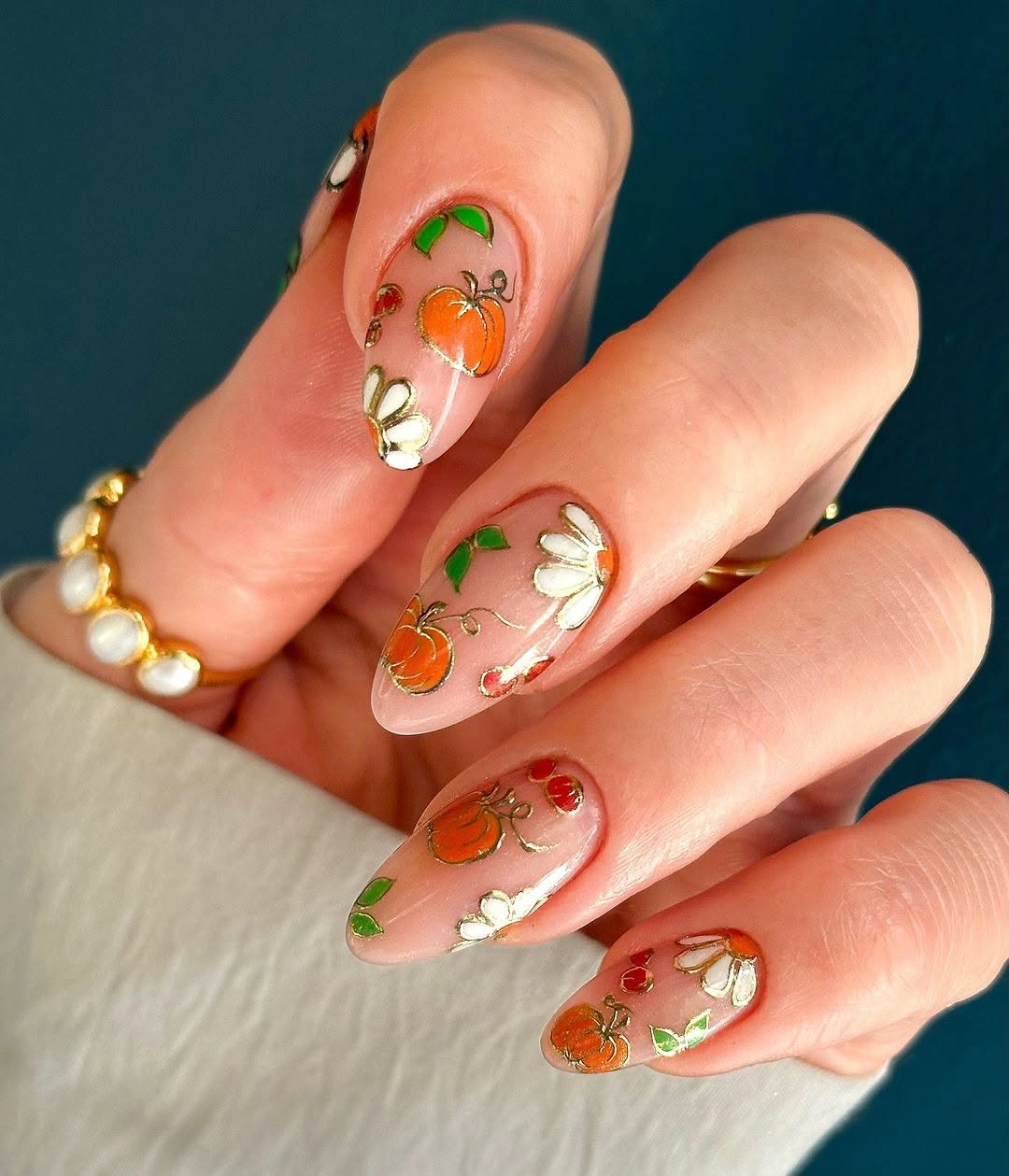 creative september nail art ideas 2026 Delicate Wildflower and Pumpkin Almond Nails