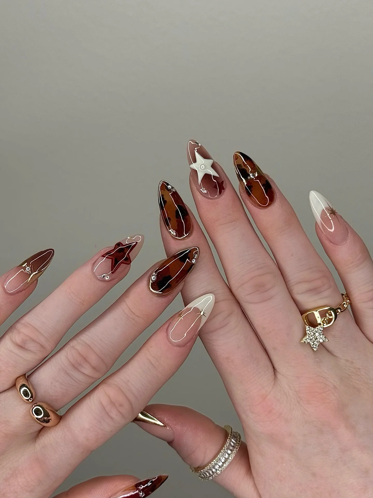 creative september nail art ideas 2026 Moody Tortoiseshell Nails with Modern Gold Details