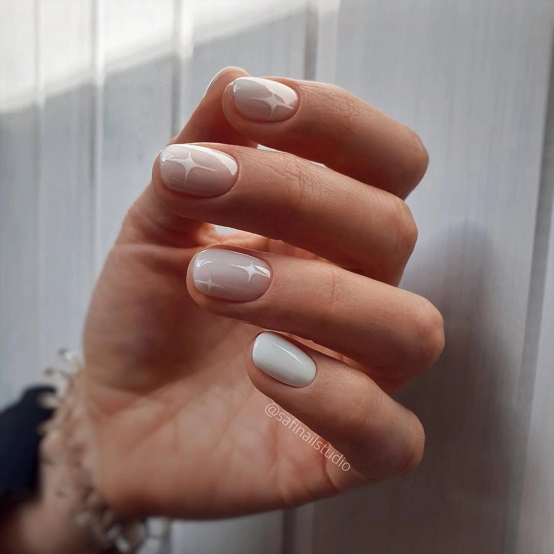 elegant fall short nails 2026 Milky White Gloss With Soft Stars