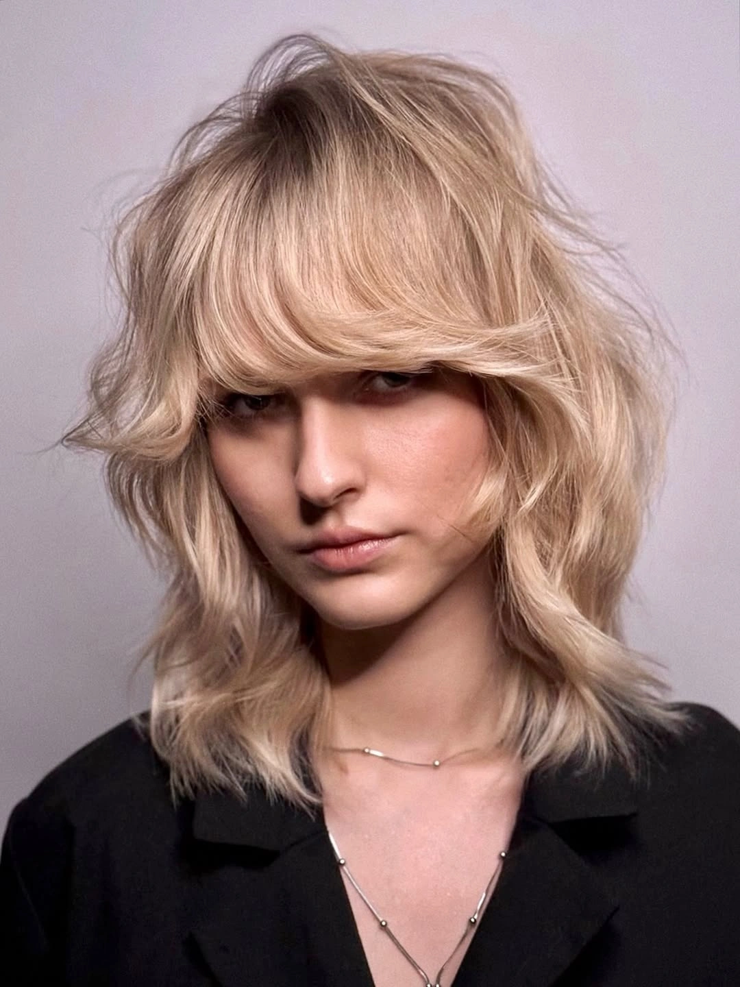 fall blonde hair colour 2026 Feathered Blonde Shag