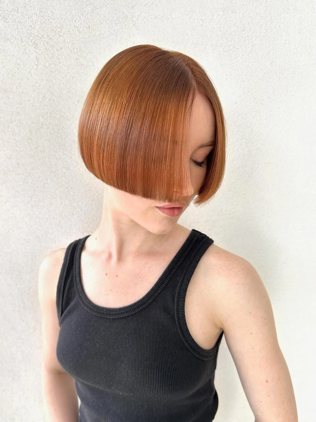 fall hair colour ideas 2026 Polished Copper Glass Bob