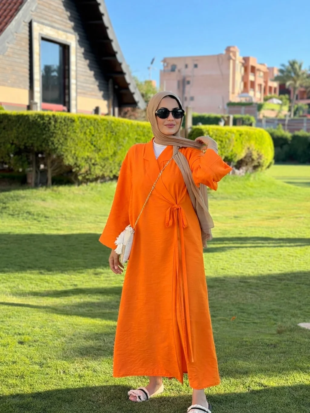 fall Wrap dress outfit 2026 A Bold Orange Wrap Dress That Brightens Gray Fall Days