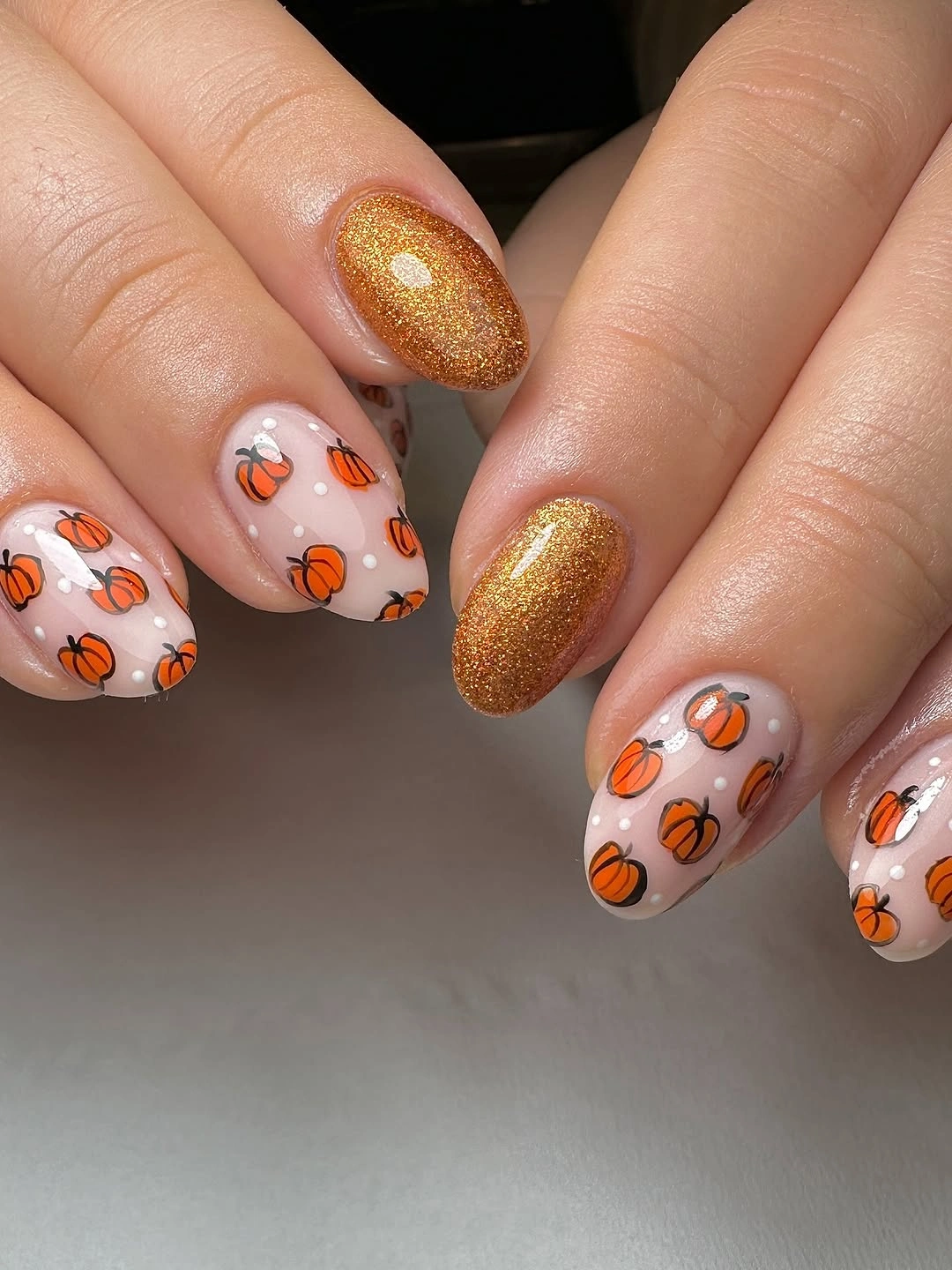 gorgeous september nail designs 2026 Tiny Pumpkin Nails With Golden Sparkle