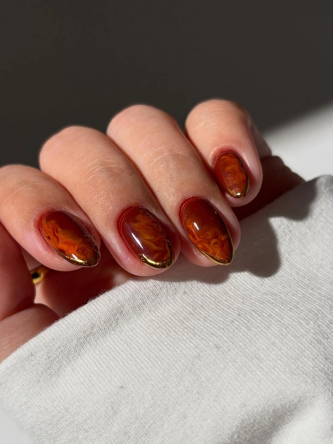 gorgeous september nail designs 2026 Rich Amber Marble With Golden Edges