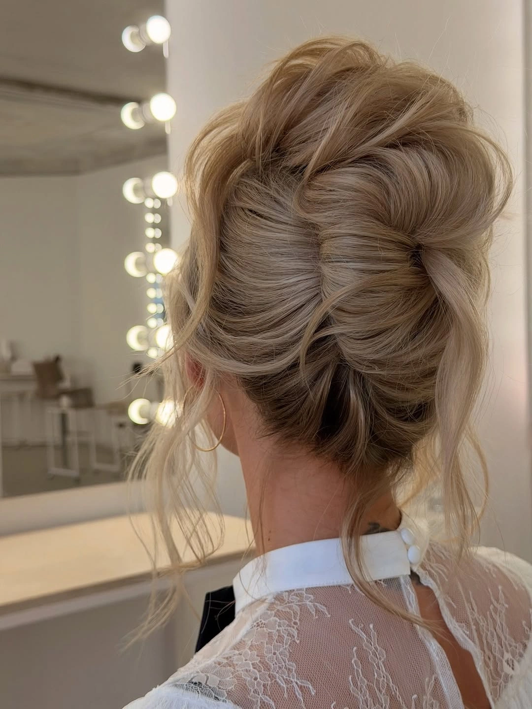 modern fall hairstyles for wedding guests 2026 Romantic Textured High Bun