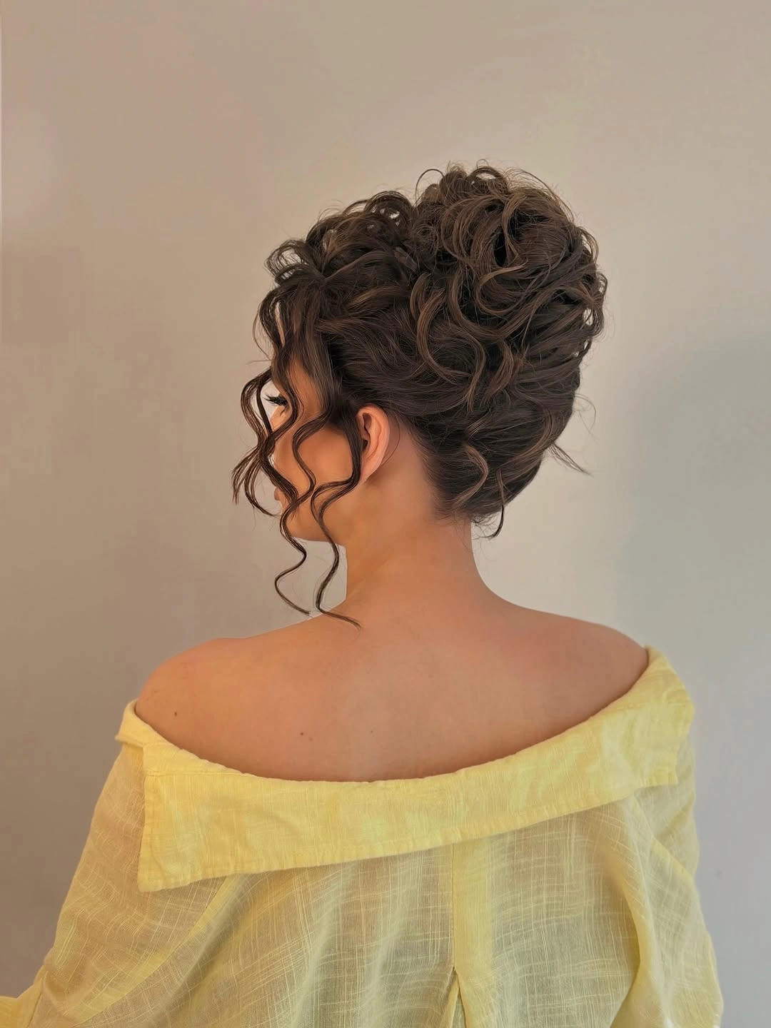 modern fall hairstyles for wedding guests 2026 Soft Curly Updo With Effortless Volume