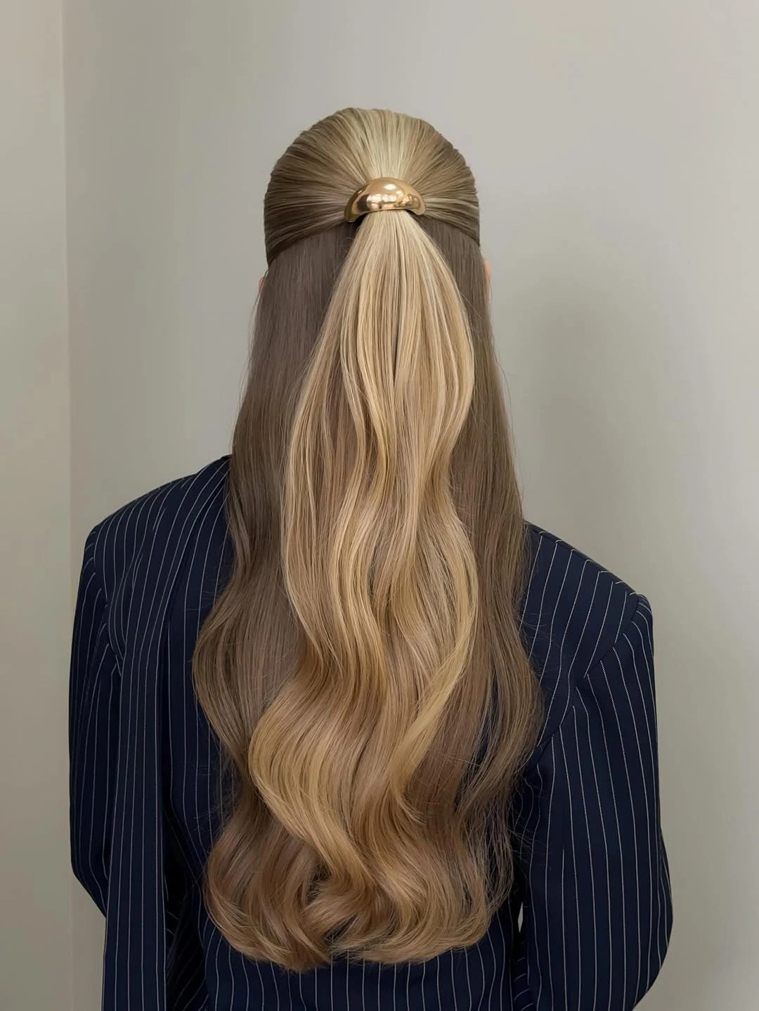 modern fall hairstyles for wedding guests 2026 Polished Half Ponytail With Dimensional Waves