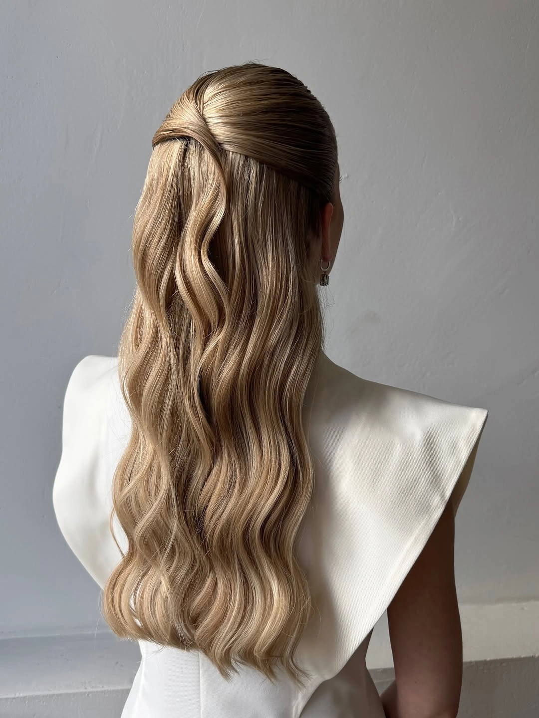 modern fall hairstyles for wedding guests 2026 Soft Half Up Waves With Seamless Volume