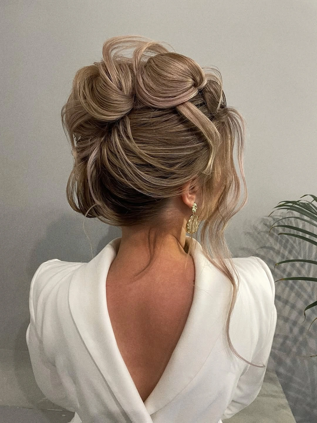 modern fall hairstyles for wedding guests 2026 Modern Twisted Bun With Airy Texture