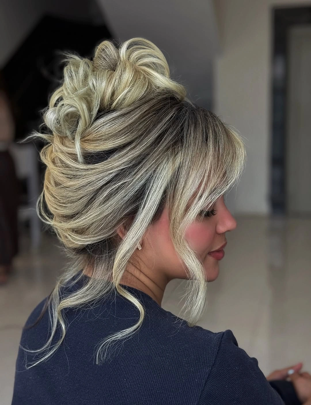 modern fall hairstyles for wedding guests 2026 Romantic Textured Updo With Soft Curtain Bangs