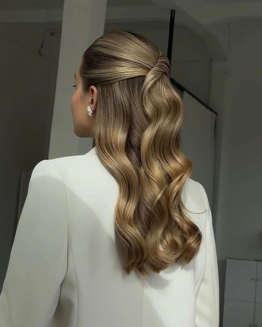 romantic bridesmaid hairstyling Soft Half Up Waves with Wrapped Detail