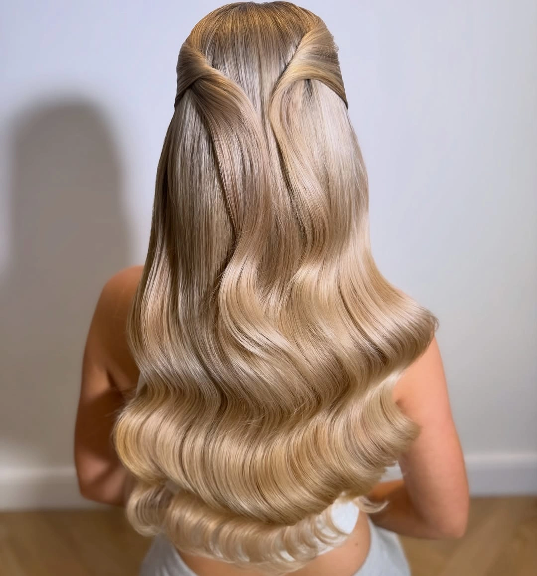 romantic bridesmaid hairstyling Glossy Half-Up Waves With Old Hollywood Romance