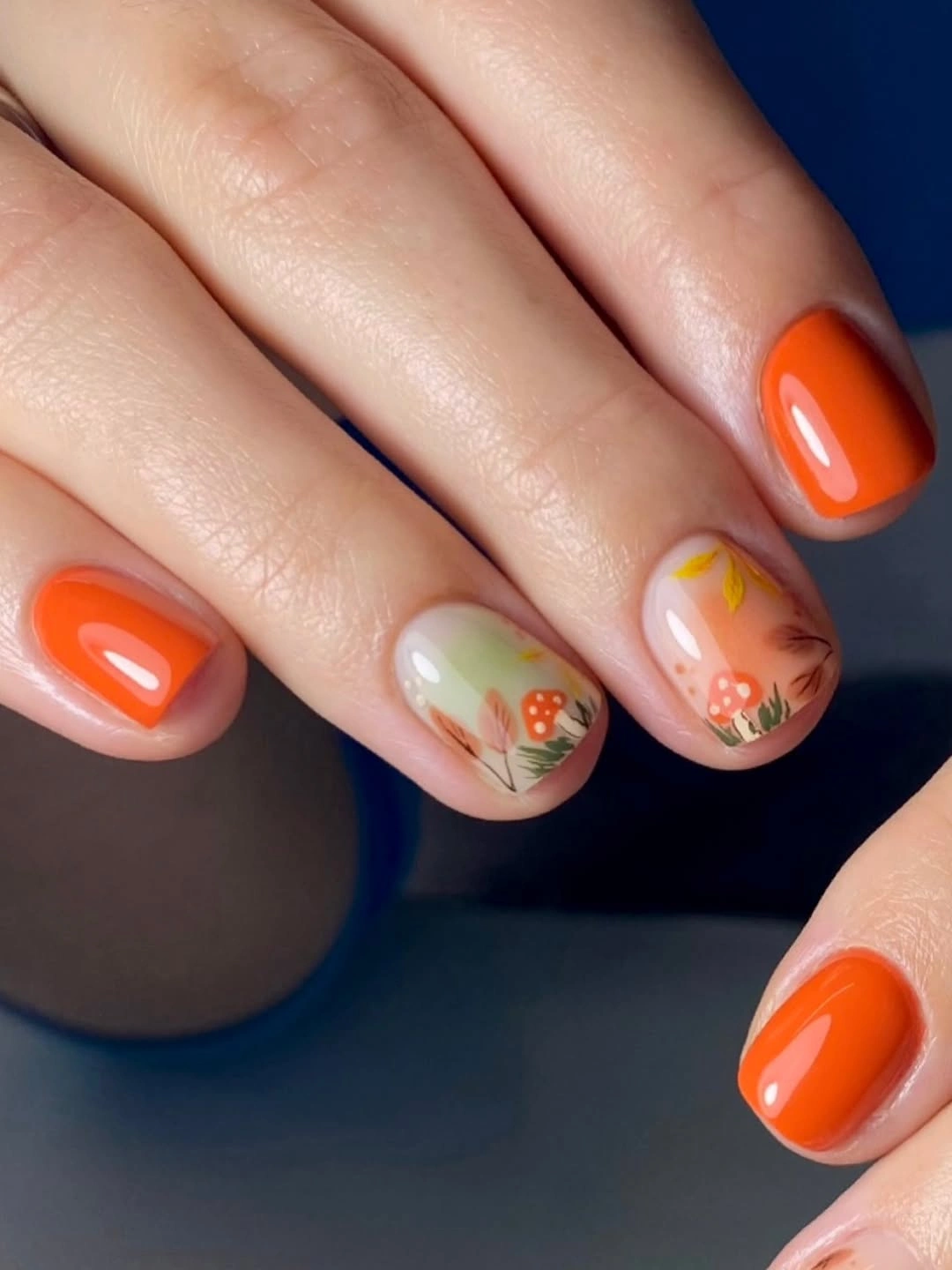 stylish fall acrylic nails 2026 Bright Orange Short Nails with Woodland Details