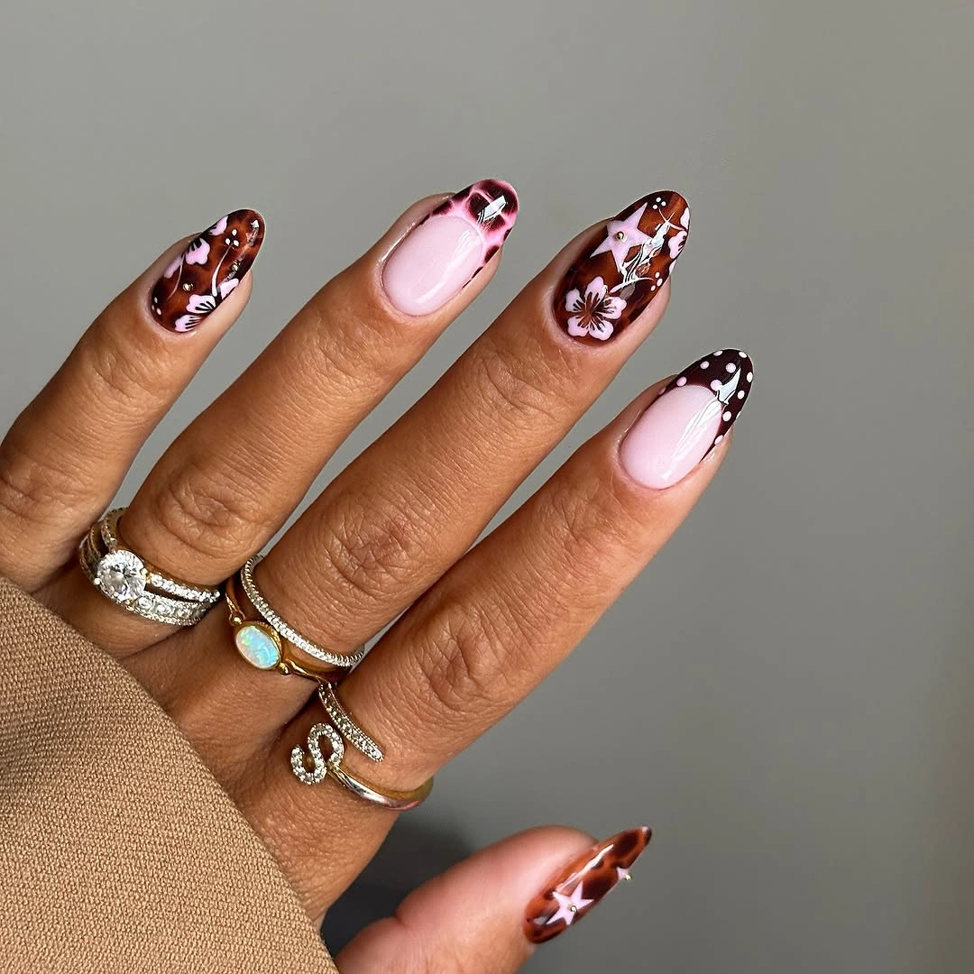 stylish fall acrylic nails 2026 Chocolate Floral French Tips with a Romantic Touch