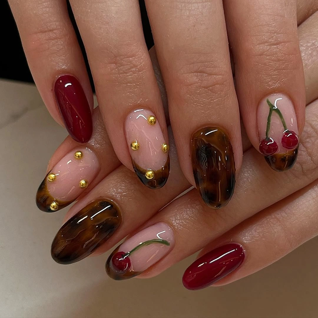 stylish fall acrylic nails 2026 Cherry Brown Acrylic Nails with Golden Stud Accents