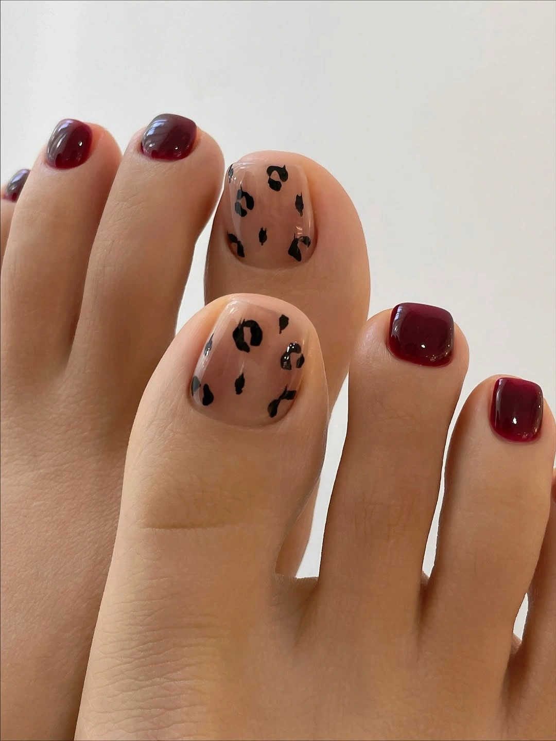 stylish fall pedicure ideas 2026 Burgundy Leopard Accent