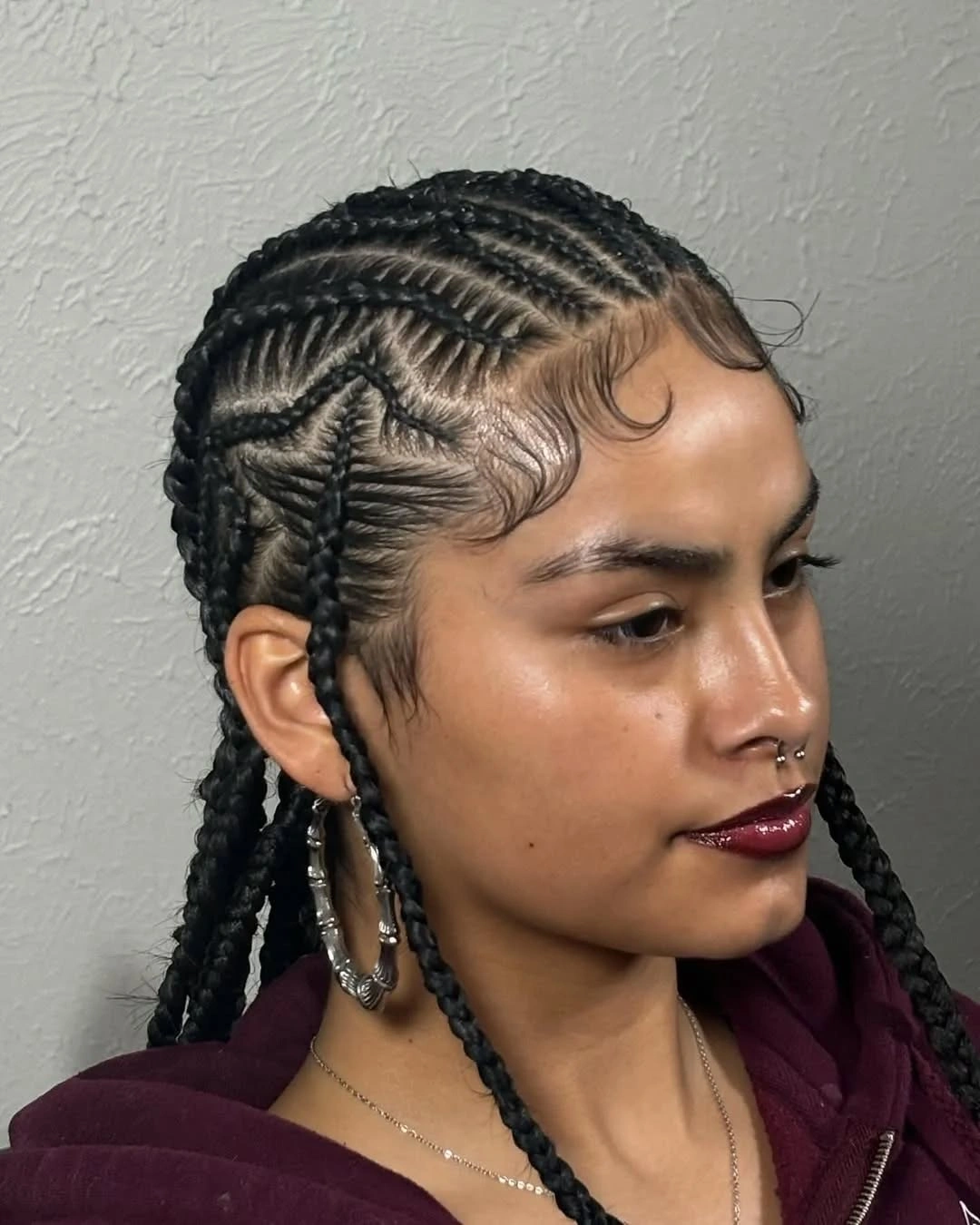 stylish feed in braid hairstyles Creative Side Pattern Feed-In Braids with Artistic Cornrow Details