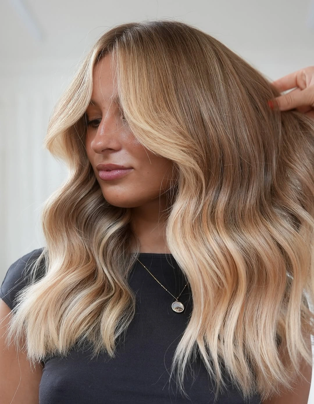 stylish hair lowlights: color ideas and inspiration Soft Vanilla Lowlights With Airy Curtain Layers
