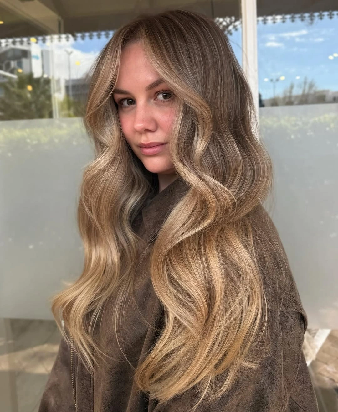 stylish hair lowlights color ideas and inspiration Golden Champagne Waves With Seamless Dimension