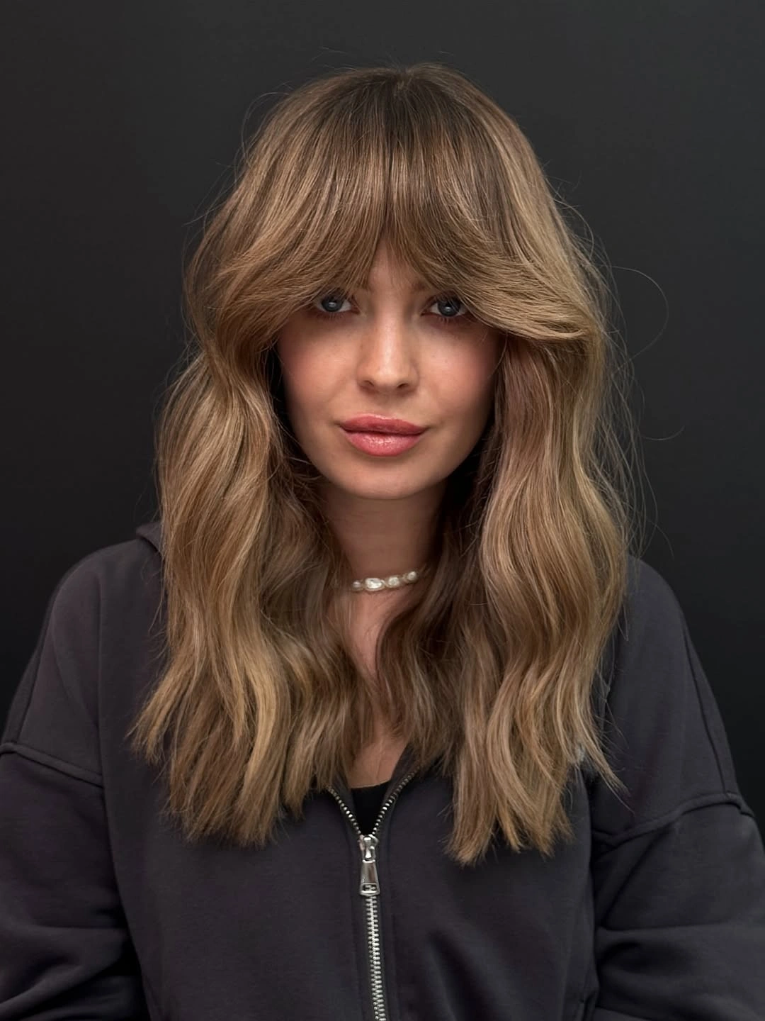 trendy choppy medium layered hair Soft Mocha Layers With Airy Curtain Bangs