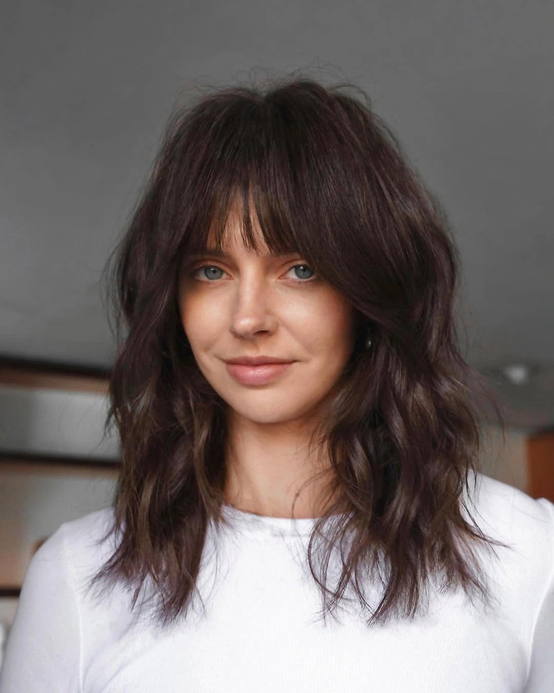 trendy choppy medium layered hair Tousled Chocolate Shag With Wispy Fringe