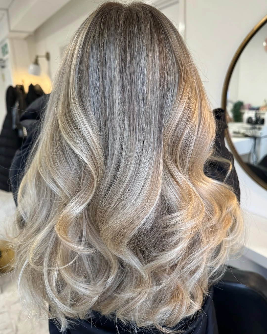 trendy dirty blonde hair color Glossy Mushroom Dirty Blonde With Soft Waves