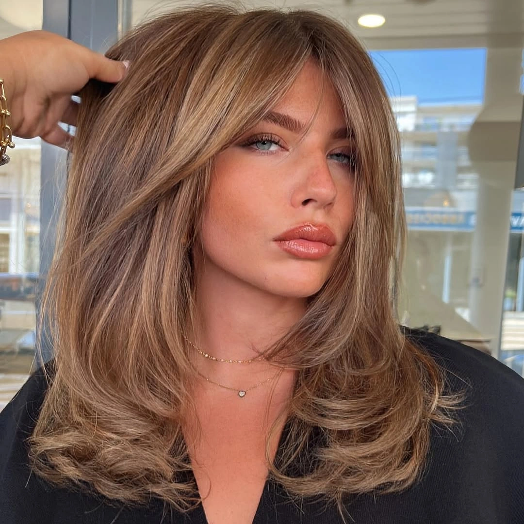 trendy dirty blonde hair color Warm Dirty Blonde Blowout With Face Framing Layers