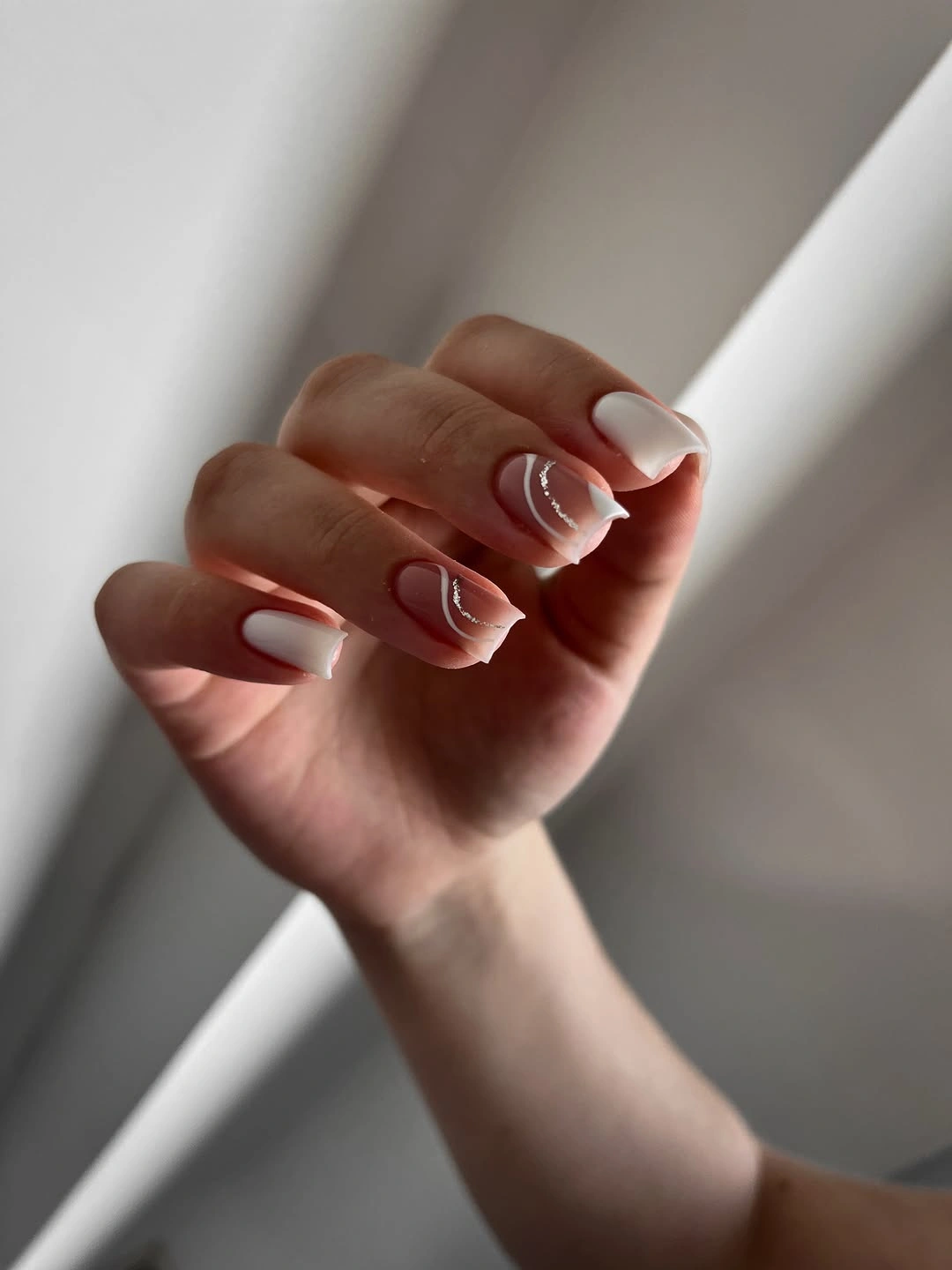 beautiful fall nails for fair skin tones 2026 White French Waves with Silver Sparkle