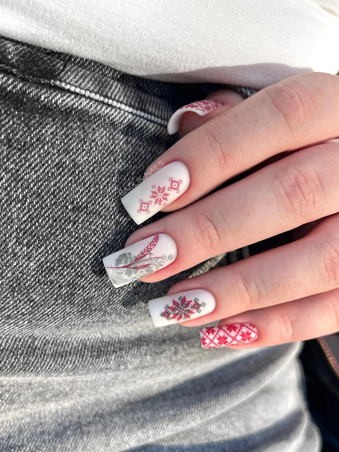 beautiful fall nails for fair skin tones 2026 Frosted White Nails With Red Folk-Inspired Details