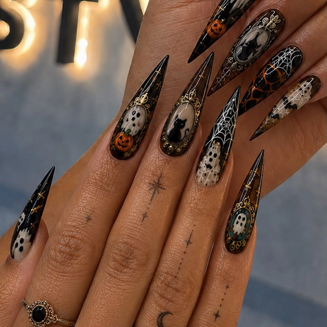 beautiful fall nails with autumn designs - Gothic Stiletto Nails With Pumpkins, Cameos and Spiderwebs