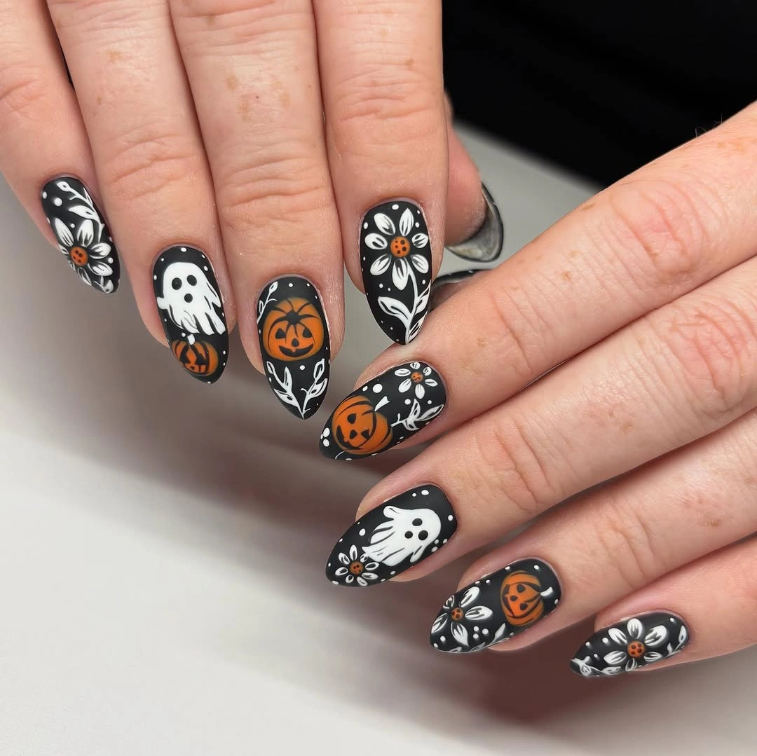 beautiful fall nails with autumn designs - Black Fall Nails With White Ghosts and Pumpkin Details