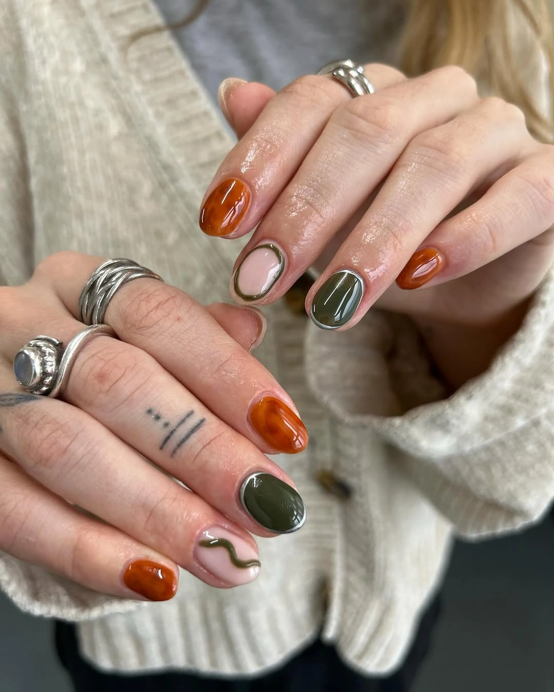 chic autumn nails color - Orange and Green Jelly Nails for a Modern Fall Look