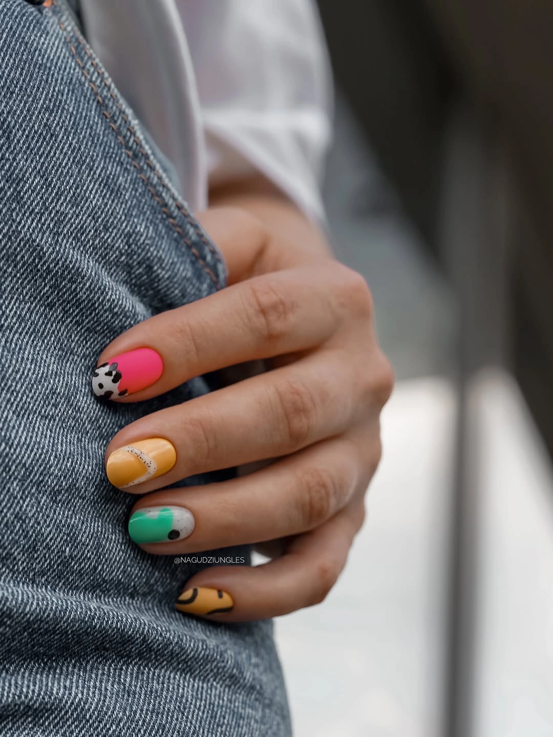 chic fall mid length nails 2026 Playful Mixed Nail Art With a Modern Twist