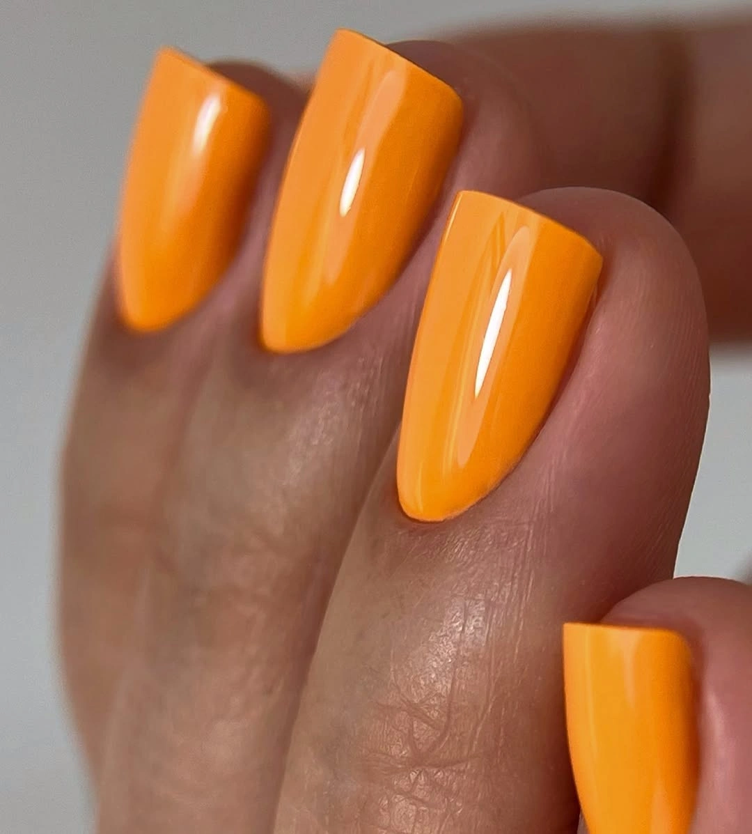 chic fall mid length nails 2026 Glossy Tangerine Nails That Brighten Autumn Days