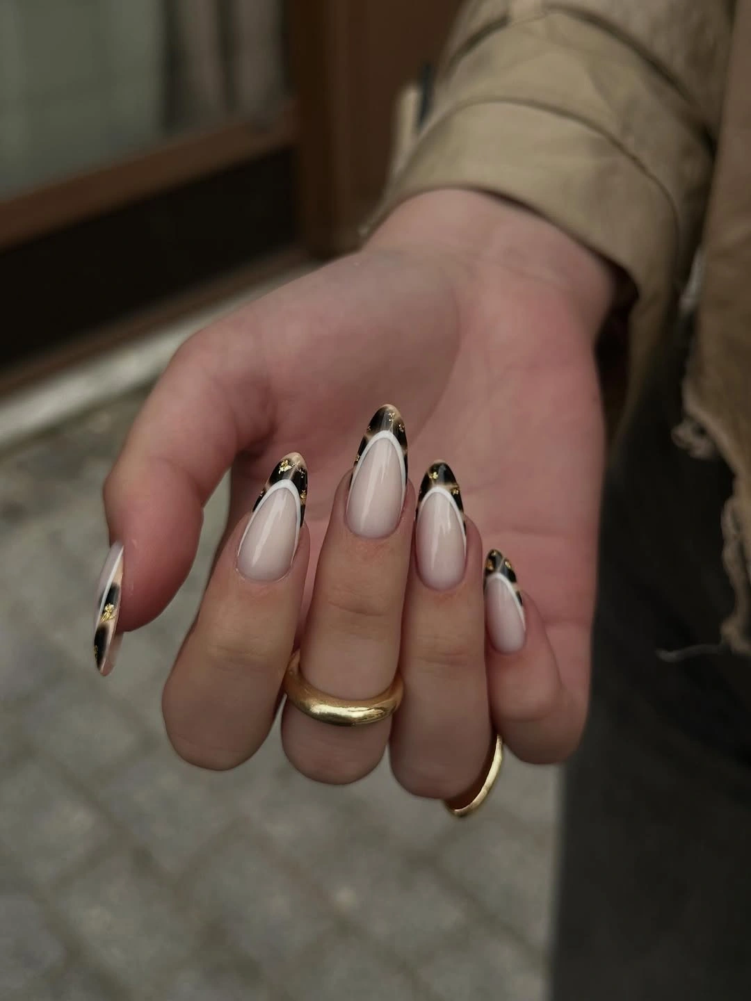 chic fall nail trends 2026 Minimal Black French With Golden Details