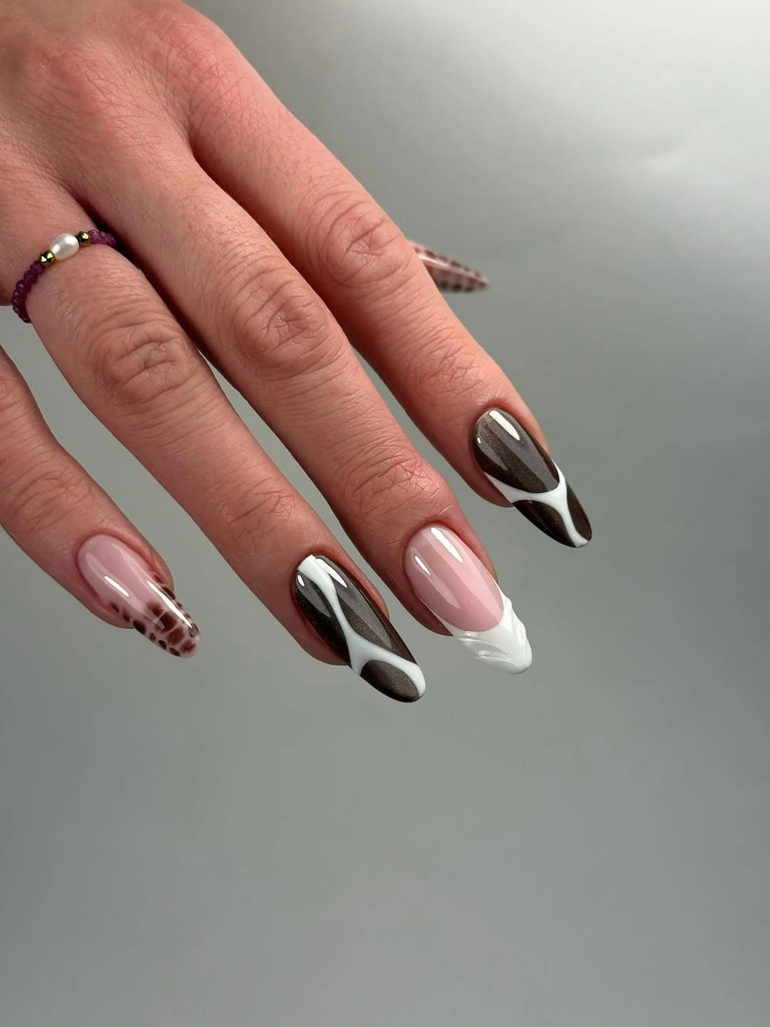 chic fall nail trends 2026 Mocha Swirls And Glossy Neutrals