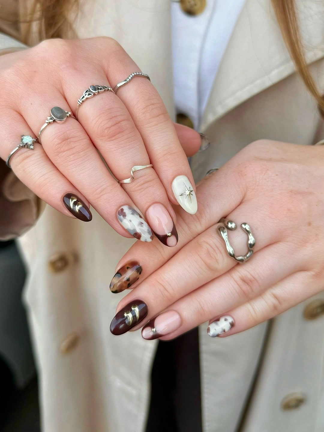 chic fall nail trends 2026 Elegant Mixed Almond Nails In Cozy Autumn Shades