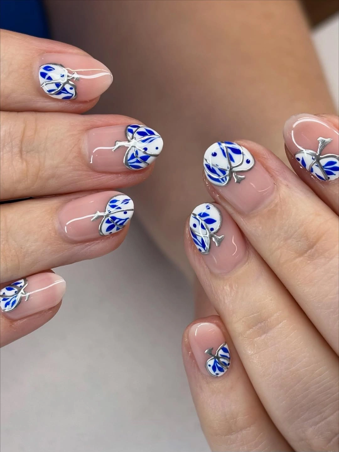 chic fall nail trends 2026 Blue Botanical Accent Nails