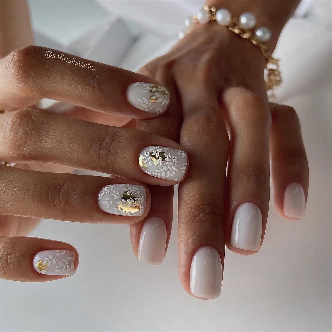 chic fall nails for medium skin tone Milky White Nails With Delicate Gold Leaves